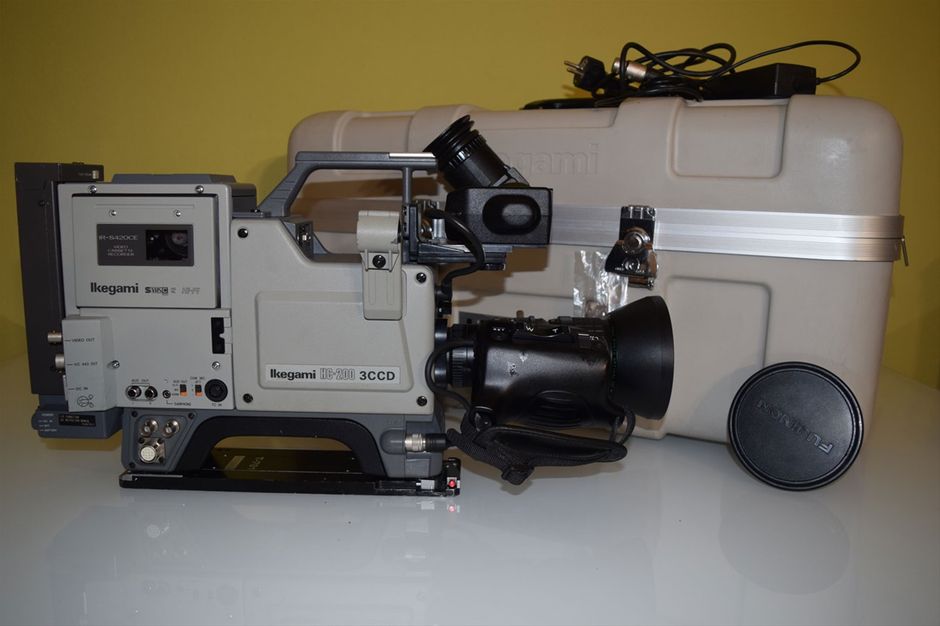 Vintage IKEGAMI HC-200 + IR-S420CE SVHS Recorder

The Ikegami's HC-200 is a compact, lightweight, high-class 3 CCD color camera for ENG and EFP. Its design incorporates an efficient 1/2-inch CCD which ensures high performance, ease of operation and high stability as well. The HC-200 is an extraordinary multi purpose color camera. It features a quality picture with low smear, CCD precision fixing technique, low-noise preamplifier and highlight compression. It also provides a variety of high-accuracy automatic controls by a microcomputer. Further, it has a character display on the viewfinder, including a highly effec- tive status display to prevent error operation. The camera can be used in conjunction with S- VHS portable VCR directly. It ensures easy on-board VCR operation. The HC-200 is provided with a full-line of accessories. It allows for a wide variety of services, including the connection of y / C separate output signal for S- VHS and the connection of a VCR com- ponent signal type for use of a BETACAM and M II, as well as services of ENG and EFP.

Features

3 CCD 
The HC-200 uses a high-efficiency CCD and a number of advanced video circuits. It assures a horizontal resolution of 530 lines or more and a signal-to-noise-ratio of higher than 58dB. It can be used in illumination as low as 20 lux minimum for f1.4 with +18dB gain. The CCD greatly reduces vertical smear, moire, ringing and fixed-pattern noise, thereby providing a high-quality picture.

Electronic Shutter 
The HC-200 has an electronic variable shutter that not only allows you to shoot a subject moving at a high speed, but it also removes fluorescent light flicker by