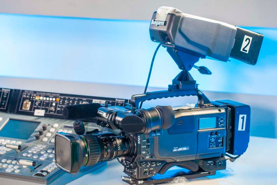Ikegami HL-DV7AW SDI 16:9 NTSC Camcorder + CCU Adapter

New Digital Process LSI
New digital process LSI (ASIC) is adopted to produce high quality video including a six - axis linear matrix system for fine tuning of color to match broadcast requirements.

Video In connector
The HL-DV7AW includes External Video Input. Pool feed or other video source can be recorded by the tape recorder section of this camera recorder. Allows user to Input an external video source for the purpose of recording it to the DV tape deck inside the camera.

Low smear and high sensitivity CCD
High quality CCD are employed to reproduce good quality PIctures even under very low light condition.

+48dB Hyper Gain for very low light conditions
Hyper gain of +48dB is provided so that good video reproduction is assured even in the harshest shooting conditions.

Super V
To enhance Vertical resolution, the Super V function can be enabled, increasing Vertical Resolution by 20%, to achieve natural picture reproduction with remarkably fine resolution.

High Resolution Viewfinder
A high resolution broadcast use 1.5 inch viewfinder is employed, featuring over 600 horizontal lines resolution. Ease of operation is carefully considered, e.g. Brightness, Contrast and Peaking controls are easily accessible on the front of the viewfinder and a rear tally light is provided. The positioning of the viewfinder is easily adjustable.

Additional Detailed Information:

DVCAM FORMAT
High Picture Quality Digital Component Recording
The DVCAM format is a digital system with Luminance signal (Y) and Color Difference signals (R-Y, B-Y).


PCM Digital Audio System
Two modes are selectable between 2ch (48kHz sampling frequency) and 4ch (32kHz sampling frequency) which may be useful for Audio After Recording (dubbing).

Long Recording Hours
Standard size cassettes have a max. 184 minutes recording time, while mini-cassettes have max. 40 minutes recording time.		
HL-DV5


EXPRESSION

Preset and Variable Shutters
The preset shutter has six speeds (1/100, 1/120, 1/250, 1/500, 1/1000, 1/2000 seconds) and variable speeds can be set between 1/60.3 and 1/787 seconds ( 1/50.3 and to 1/781 for PAL).


Diagonal Detail for higher picture quality
The diagonal detail function increases sharpness in the diagonal direction. This function also helps to reduce cross color moire in NTSC.


Skin Detail for favorable reproduction
The skin detail function is used when skin quality is being emphasized. The edge sharpness of the skin tone can be softened so that wrinkles or age lines become less visible on the TV screen. AHD, Auto Hue Detect, for easy setting of Skin tone detail is employed.


Soft Detail Function
To ensure picture uniformity even with high contrast areas, Soft Detail is employed to produce images that are more natural, without excessive adge enhancement.


Variable Detail Settings
8 step variable frequency boost of the detail signal and B/W balance function which controls center luminance level of detail signal are provided to have better detail effects depending on the subject.

 
HL-DV7W:	2.97MHz to 6.84MHz at 4:3 mode
3.24MHz to 9.00MHz at 16:9 mode
HL-DV5:	2.97MHz to 6.84MHz


Various GAMMA settings
Not only are 4 types of GAMMA characteristics selectable (OFF/0.35/0.4 /0.45), but a GAMMA curve pattern with x5 initial gain is also selectable for certain broadcast requirement.


Black Press
To emphasize only the brighter areas of images, Black Press is provided. It is selectable in 3 steps (-7%, -5%, -3%). It can add contrast to a washed out picture.


Black Stretch
The black stretch function meets the needs of professional camera-persons who want to avoid excessive dark areas in high contrast scenes. With three settings (3, 5 and 7%), this function enables improvement in dark areas in the picture by lifting the image level of only low brightness areas.


Shock-less Auto White Balance
To avoid a sudden change in white balance when switching between white balance memories, change over time is selectable. This function exhibits superb results when the scene changes from an indoor to outdoor shot or vice versa.


OFF:	Changes Memory Data instantly
ON - 0.3s :	Changes Memory Data in 0.3 seconds.
ON - 0.5s :	Changes Memory Data in 0.5 seconds.
ON - 1.0s :	Changes Memory Data in 1.0 seconds.
ON - 1.5s :	Changes Memory Data in 1.5 seconds.
ON - 2.0s :	Changes Memory Data in 2.0 seconds.


OPERATION

A low center of gravity camera design
Ikegami's long and rich experience in professional TV camera design has enabled us to produce a one-piece camera + recorder with excellent ergonomics and very good weight balance for the comfort of the operator.


Specially designed Shoulder Pad 
A newly and specially designed shoulder pad made of non-slip material makes camera work easier. The pad can be esily adjusted.


Convenient P. FUNC switch
P. FUNC (Personal Function) switch is provided for the most frequently used functions for the operator's convenience, such as control of scene file recall, Soft Detail, and Black Press/Black Stretch.


Rotary Encoders for easier Setup
On the lower side of the camera, 3 rotary encoders are provided for easier access to setup parameters. This allows camera settings and checkups even without a remote control panel.


Camera Menu
The camera incorporates a very practical menu system which is easy to navigate with a rotary encoder at the front of the camera. The menu can be customized for specific users by changing which control items are included.


Instant recall to the Factory Preset condition
Sometimes it is useful to be able to go back to the factory's original settings. The 
