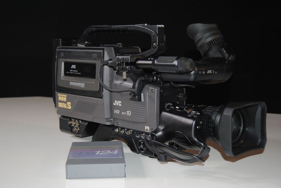 Vintage JVC BR-D40U DIGITAL S 4:2:2 Recorder with Camcorder D9 Video Camera.
The BR-D40 offers all the high quality of Digital-S in a convenient dockable configuration. It docks not only to JVC cameras, but to other manufacturers' cameras as well.

Perceptually loseless, high picture quality with 3.3:1 compression, and 8 bit 4:2:2 component digital recording. DTV, 16:9 ready.

104 minute recording time

Color playback with 10X picture search

2 time code reader-generators with jam sync and external lock.

Specifications

Format: DIGITAL-S

Tape width: ½ in.

Tape speed: 57.737mm/s

Video signal system: Component digital signal with Digital-S compression (DCT based)

Timecode: based on SMPTE 12M

Dimension: 247 x 253 x 142mm (tentative)

Weight: less than 3.5kg (tentative)

Power consumption: Less than 1.6A (tentative)

Power requirement:

12 V DC

11 V to 15 V DC (permissible voltage range)

Maximum voltage: 17 Volts DC (less than 5 min.)

Recording/PB time: 124 min. (with DS-104 tape)

FF/REW time: approx. 4 min. (with DS-104 tape)

VIDEO

Input:

Camera (50 pin) component

Y:1/R-Y,B-Y:0.7Vpp,75 ohms unbalanced

Output: Composite (BNC) 1.0Vpp,75 ohms unbalanced

External sync input: none

AUDIO

Inputs

Camera (50 pin): -20dBs, 3k ohms, balanced X2

Line (XLR): -60/+4dBs, 10k ohms/3k ohms , balanced X2

Outputs

Line: -6dBs, low-impedance, unbalanced X2

Headphone: -17dBs, low-impedance

Number of PCM tracks: 2

Number of cue tracks: 2

PCM Frequency Response: 20~20,000Hz +1/-1.5dB

PCM Dynamic Range: more than 85dB

Wow & Flutter: less than measurable limit

Timecode(LTC only)

Input: 0±6dBs, high-impedance, unbalanced

Output: 0±6dBs, low-impedance, unbalanced





DIGITAL-S Highlights

4:2:2 Component Digital Processing

DIGITAL-S's outstanding picture quality is derived from 4:2:2, 8-bit component processing that assures the highest resolution and color detail even over multiple generations. Horizontal resolution for the system is 720 pixels or 540 TV lines. To maintain the best possible image quality in multi-generation editing and digital search, the compression ratio is set to a very mild 3.3 to 1 with DCT-based intra-frame coding and a data recording rate of 50 Mbps. The combination of these specifications with wide-band component recording enables DIGITAL-S to reproduce the finest color details and subtlest contrasts of an image while minimizing artifacts.



Video Pre-Read

Video pre-read (BR-D85U only), never before available on a system in this price range, enables the recorder to first play back the digital signal on the tape, modify it with an external device, then re-record the modified signal in its place. It's a capability that allows an A/B roll system to be built with only two VTRs instead of three, saving the cost of one VTR. In addition, video pre-read allows complex layering effects to be performed even when working with a simple switcher with only one mix/effects bank. For multiformat editing, adding just one high quality DIGITAL-S recording deck with pre-read will provide virtually lossless editing, which means your finished tape will look like your original source footage. No other upgrade or addition to your current editing suite can provide such a dramatic increase in video picture quality.



Recording Time

High-resolution DIGITAL-S signals are captured and preserved on a high-density 1/2-inch tape featuring an advanced metal particle formulation based on W-VHS HDTV technology. Tape speed is 57.8 mm/s with a maximum recording time of 104 minutes. The cassette dimensions are the same as those of VHS. However, the cassette housing features a newly developed dust-proof cover and cannot be loaded into conventional VHS decks.



Digital Sound

DIGITAL-S's audio specifications are just as impressive. Two independently editable, 16-bit PCM (pulse code modulation) signals can be recorded with a sampling frequency of 48 kHz, ensuring audio quality equal to today's most exacting standards. 2 linear cue tracks mirror the digital audio channels for effortless audio scrubbing and cueing.



Editing Facilities

The advanced capabilities of JVC's DIGITAL-S bring a new world of powerful editing features to your edit suite. Editing features include video pre-read (BR-D85U only), 2 independent time code reader/generators built in with VITC/LTC built-in time code recording. Independent editing of video, TC, or either channel of PCM audio is possible. A versatile range of search functions available via the jog/shuttle controls allow footage to be viewed in color at speeds of up to ± 32x Continuous, noiseless slow-motion playback is also available within a range of ± 1/3.



Self-Diagnosis

Thanks to the RS-232C interface, you can check the VTR's operating condition without interfering with operation. When the request command is sent via the 232C interface, diagnostic checks are run for head clogging, error rate, etc.



Genlock/TBC Adjustment

System phase, SC phase and video phase can be adjusted on the front panel while video level, chroma phase, chroma level and setup level can be adjusted remotely via the 15-pin D-SUB connector provided on the rear panel.



Slow Motion

Slow-motion field or frame playback is menu-selectable.



On-Screen Menu

To permit easy access to a full array of professional functions, DIGITAL-S VTRs incorporate an on-screen menu. Menu data is superimposed on the video monitor output. This menu system allows you to set 50 items while referring to the counter or on-screen display. Besides reducing the number of external switches, this system lessens the chance of function settings being accidentally switched on or off as is possible with external switches. A full set of LED indicators on the front panel assure you that the desired functions are engaged. On-screen mode check and warning indications are also provided. And, since the menu system is hierarchical, pressing one of the Direct Menu Access buttons allows you to go straight to the desired menu.



Systems Flexibility

JVC's new DIGITAL-S recorders are designed for easy incorporation in any existing edit suite. Interfaces are provided for analog composite, Y/C, and component signals. Serial digital video interface (SMPTE259M and AES/EBU digital audio) is also available as an option.



Drum Structure

To ensure DIGITAL-S/S-VHS mode compatibility, the drum structure features an upper stationary drum, a middle rotary drum and a lower stationary drum. (A conventional drum, on the other hand, consists of an upper rotary drum and a lower stationary drum.) Recording and playback heads on the middle drum make stable tape movement possible even at 4,500 rpm, while channel separation is improved by splitting the digital recording and playback rotary transformer between the upper and lower drums. The rotary drum itself is very narrow. This eliminates thicker air film at the drum inlet, ensures stable head-to-tape contact, and optimizes track linearity. The inner drum is tapered in order to reduce tape damage, powder drop, wear, and burn at the drum area. The material used to manufacture the drum has a higher silicone content than conventional aluminum alloy to improve wear resistance. The system uses a two-track, parallel recording system with two pairs of record heads located at 180 degrees to each other, and two pairs of playback heads located 90 degrees from the record heads. In addition, two erase heads are provided.



Other Features

Repeat playback from the beginning to the end of a tape

Auto rewind at the end of a tape

Counter search

Jog/Shuttle search dials

Remote control via RS-422A interface using industry standard command set

External sync analog reference signal input

Capstan bump for frame synchronization

Preroll function with user-designated time setting

Headphone output with level control

Playback error checking with LED status display

Auto tracking (with manual mode)

Time code re-generation external TC or jam sync (BR-D85U and BR-D80U only)

Manual audio recording level adjustment (exclusively for analog sources: BR-D85U and BR-D80U only)

ORC (optimized record current) auto setting in the adjustment mode (BR-D85U and BR-D80U only)

Two uncompressed lines for closed caption and teletext recording, selectable by using the menu switch settings (BR-D85U and BR-D80U only)