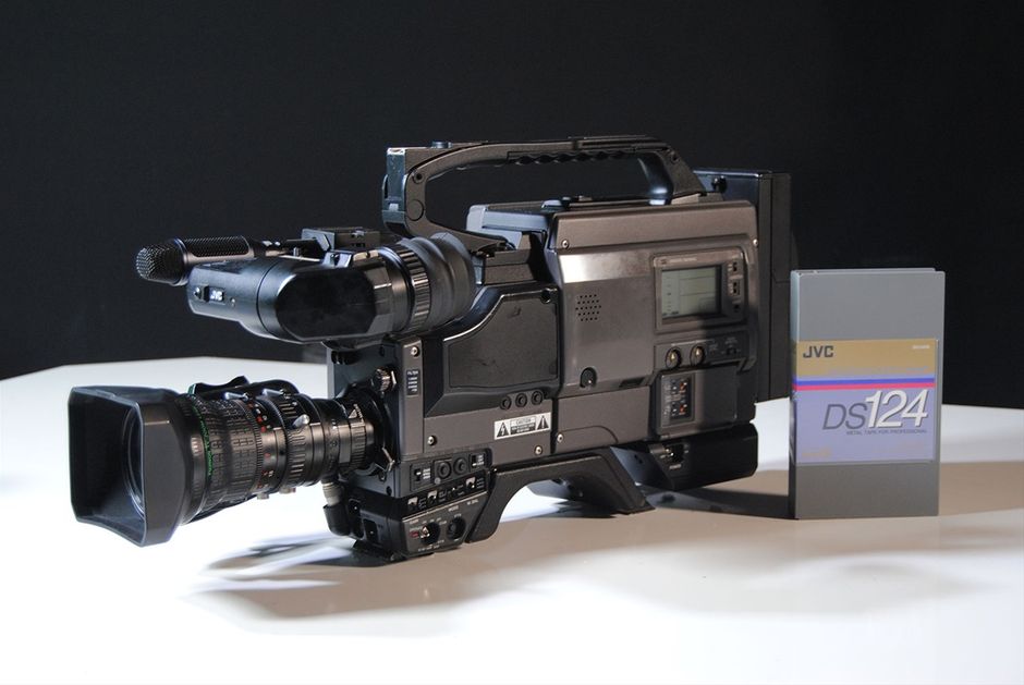 Vintage JVC BR-D40U DIGITAL S 4:2:2 Recorder with Camcorder D9 Video Camera.
The BR-D40 offers all the high quality of Digital-S in a convenient dockable configuration. It docks not only to JVC cameras, but to other manufacturers' cameras as well.

Perceptually loseless, high picture quality with 3.3:1 compression, and 8 bit 4:2:2 component digital recording. DTV, 16:9 ready.

104 minute recording time

Color playback with 10X picture search

2 time code reader-generators with jam sync and external lock.

Specifications

Format: DIGITAL-S

Tape width: ½ in.

Tape speed: 57.737mm/s

Video signal system: Component digital signal with Digital-S compression (DCT based)

Timecode: based on SMPTE 12M

Dimension: 247 x 253 x 142mm (tentative)

Weight: less than 3.5kg (tentative)

Power consumption: Less than 1.6A (tentative)

Power requirement:

12 V DC

11 V to 15 V DC (permissible voltage range)

Maximum voltage: 17 Volts DC (less than 5 min.)

Recording/PB time: 124 min. (with DS-104 tape)

FF/REW time: approx. 4 min. (with DS-104 tape)

VIDEO

Input:

Camera (50 pin) component

Y:1/R-Y,B-Y:0.7Vpp,75 ohms unbalanced

Output: Composite (BNC) 1.0Vpp,75 ohms unbalanced

External sync input: none

AUDIO

Inputs

Camera (50 pin): -20dBs, 3k ohms, balanced X2

Line (XLR): -60/+4dBs, 10k ohms/3k ohms , balanced X2

Outputs

Line: -6dBs, low-impedance, unbalanced X2

Headphone: -17dBs, low-impedance

Number of PCM tracks: 2

Number of cue tracks: 2

PCM Frequency Response: 20~20,000Hz +1/-1.5dB

PCM Dynamic Range: more than 85dB

Wow & Flutter: less than measurable limit

Timecode(LTC only)

Input: 0±6dBs, high-impedance, unbalanced

Output: 0±6dBs, low-impedance, unbalanced





DIGITAL-S Highlights

4:2:2 Component Digital Processing

DIGITAL-S's outstanding picture quality is derived from 4:2:2, 8-bit component processing that assures the highest resolution and color detail even over multiple generations. Horizontal resolution for the system is 720 pixels or 540 TV lines. To maintain the best possible image quality in multi-generation editing and digital search, the compression ratio is set to a very mild 3.3 to 1 with DCT-based intra-frame coding and a data recording rate of 50 Mbps. The combination of these specifications with wide-band component recording enables DIGITAL-S to reproduce the finest color details and subtlest contrasts of an image while minimizing artifacts.



Video Pre-Read

Video pre-read (BR-D85U only), never before available on a system in this price range, enables the recorder to first play back the digital signal on the tape, modify it with an external device, then re-record the modified signal in its place. It's a capability that allows an A/B roll system to be built with only two VTRs instead of three, saving the cost of one VTR. In addition, video pre-read allows complex layering effects to be performed even when working with a simple switcher with only one mix/effects bank. For multiformat editing, adding just one high quality DIGITAL-S recording deck with pre-read will provide virtually lossless editing, which means your finished tape will look like your original source footage. No other upgrade or addition to your current editing suite can provide such a dramatic increase in video picture quality.



Recording Time

High-resolution DIGITAL-S signals are captured and preserved on a high-density 1/2-inch tape featuring an advanced metal particle formulation based on W-VHS HDTV technology. Tape speed is 57.8 mm/s with a maximum recording time of 104 minutes. The cassette dimensions are the same as those of VHS. However, the cassette housing features a newly developed dust-proof cover and cannot be loaded into conventional VHS decks.



Digital Sound

DIGITAL-S's audio specifications are just as impressive. Two independently editable, 16-bit PCM (pulse code modulation) signals can be recorded with a sampling frequency of 48 kHz, ensuring audio quality equal to today's most exacting standards. 2 linear cue tracks mirror the digital audio channels for effortless audio scrubbing and cueing.



Editing Facilities

The advanced capabilities of JVC's DIGITAL-S bring a new world of powerful editing features to your edit suite. Editing features include video pre-read (BR-D85U only), 2 independent time code reader/generators built in with VITC/LTC built-in time code recording. Independent editing of video, TC, or either channel of PCM audio is possible. A versatile range of search functions available via the jog/shuttle controls allow footage to be viewed in color at speeds of up to ± 32x Continuous, noiseless slow-motion playback is also available within a range of ± 1/3.



Self-Diagnosis

Thanks to the RS-232C interface, you can check the VTR's operating condition without interfering with operation. When the request command is sent via the 232C interface, diagnostic checks are run for head clogging, error rate, etc.



Genlock/TBC Adjustment

System phase, SC phase and video phase can be adjusted on the front panel while video level, chroma phase, chroma level and setup level can be adjusted remotely via the 15-pin D-SUB connector provided on the rear panel.



Slow Motion

Slow-motion field or frame playback is menu-selectable.



On-Screen Menu

To permit easy access to a full array of professional functions, DIGITAL-S VTRs incorporate an on-screen menu. Menu data is superimposed on the video monitor output. This menu system allows you to set 50 items while referring to the counter or on-screen display. Besides reducing the number of external switches, this system lessens the chance of function settings being accidentally switched on or off as is possible with external switches. A full set of LED indicators on the front panel assure you that the desired functions are engaged. On-screen mode check and warning indications are also provided. And, since the menu system is hierarchical, pressing one of the Direct Menu Access buttons allows you to go straight to the desired menu.



Systems Flexibility

JVC's new DIGITAL-S recorders are designed for easy incorporation in any existing edit suite. Interfaces are provided for analog composite, Y/C, and component signals. Serial digital video interface (SMPTE259M and AES/EBU digital audio) is also available as an option.



Drum Structure

To ensure DIGITAL-S/S-VHS mode compatibility, the drum structure features an upper stationary drum, a middle rotary drum and a lower stationary drum. (A conventional drum, on the other hand, consists of an upper rotary drum and a lower stationary drum.) Recording and playback heads on the middle drum make stable tape movement possible even at 4,500 rpm, while channel separation is improved by splitting the digital recording and playback rotary transformer between the upper and lower drums. The rotary drum itself is very narrow. This eliminates thicker air film at the drum inlet, ensures stable head-to-tape contact, and optimizes track linearity. The inner drum is tapered in order to reduce tape damage, powder drop, wear, and burn at the drum area. The material used to manufacture the drum has a higher silicone content than conventional aluminum alloy to improve wear resistance. The system uses a two-track, parallel recording system with two pairs of record heads located at 180 degrees to each other, and two pairs of playback heads located 90 degrees from the record heads. In addition, two erase heads are provided.



Other Features

Repeat playback from the beginning to the end of a tape

Auto rewind at the end of a tape

Counter search

Jog/Shuttle search dials

Remote control via RS-422A interface using industry standard command set

External sync analog reference signal input

Capstan bump for frame synchronization

Preroll function with user-designated time setting

Headphone output with level control

Playback error checking with LED status display

Auto tracking (with manual mode)

Time code re-generation external TC or jam sync (BR-D85U and BR-D80U only)

Manual audio recording level adjustment (exclusively for analog sources: BR-D85U and BR-D80U only)

ORC (optimized record current) auto setting in the adjustment mode (BR-D85U and BR-D80U only)

Two uncompressed lines for closed caption and teletext recording, selectable by using the menu switch settings (BR-D85U and BR-D80U only)